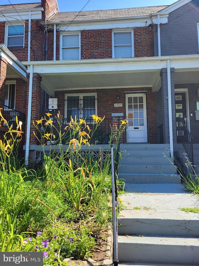 2321 13th Pl NE, Washington, DC 20018 - view of front facade featuring brick siding and a porch
