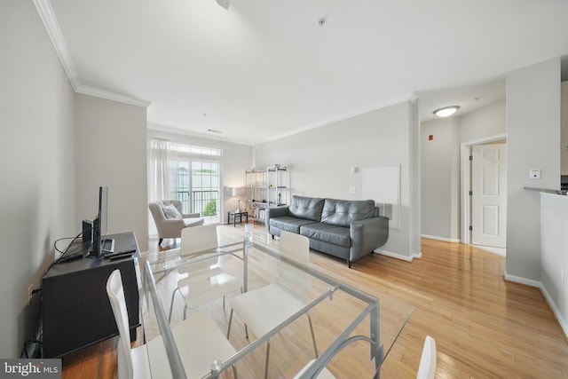 2465 Army Navy Dr Unit 1-303, Arlington, VA 22206 - living area featuring crown molding, light wood-type flooring, and baseboards
