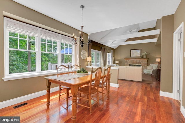 1337 Pennsridge Pl, Downingtown, PA 19335 - dining space with wood finished floors, baseboards, a fireplace, lofted ceiling, and ceiling fan