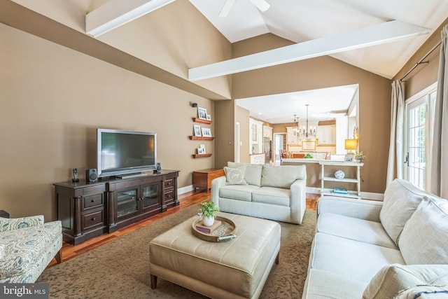 1337 Pennsridge Pl, Downingtown, PA 19335 - living area featuring vaulted ceiling, a chandelier, wood finished floors, a ceiling fan, and baseboards