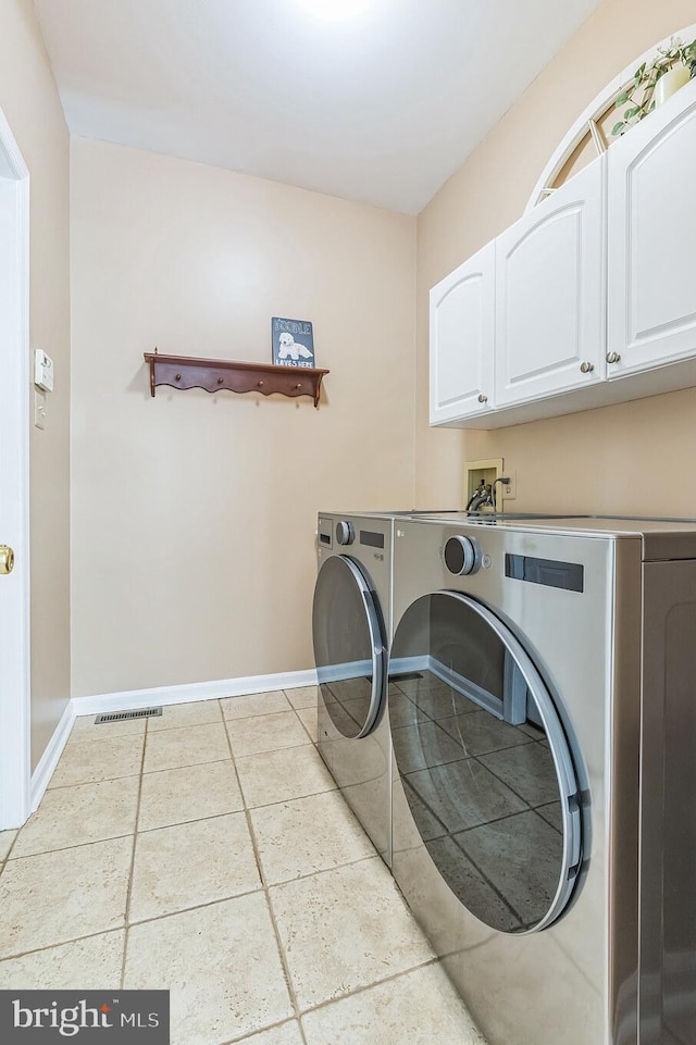 1337 Pennsridge Pl, Downingtown, PA 19335 - laundry room with cabinet space, washer and clothes dryer, baseboards, and light tile patterned flooring