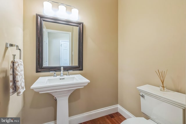 1337 Pennsridge Pl, Downingtown, PA 19335 - bathroom with baseboards, toilet, and wood finished floors