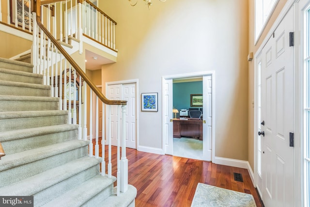 1337 Pennsridge Pl, Downingtown, PA 19335 - foyer with a towering ceiling, baseboards, stairs, wood finished floors, and a chandelier