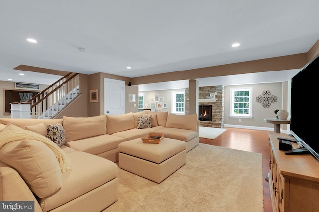 1337 Pennsridge Pl, Downingtown, PA 19335 - living room featuring wood finished floors, stairs, recessed lighting, and a stone fireplace