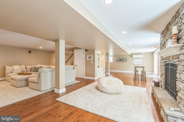 1337 Pennsridge Pl, Downingtown, PA 19335 - living area with wood finished floors, a stone fireplace, baseboards, and recessed lighting