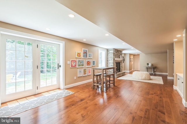 1337 Pennsridge Pl, Downingtown, PA 19335 - dining space with baseboards, hardwood / wood-style flooring, a stone fireplace, and recessed lighting