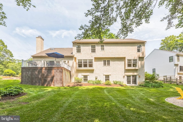 1337 Pennsridge Pl, Downingtown, PA 19335 - back of property featuring a lawn, a chimney, stucco siding, and a deck