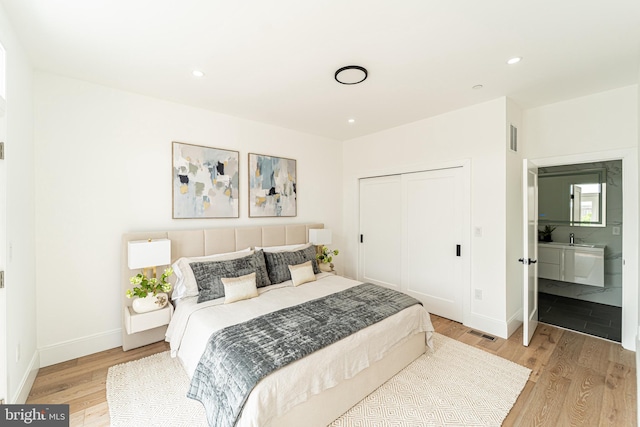2517 Ontario Rd NW Unit Ph8, Washington, DC 20009 - bedroom featuring light wood-style floors, a closet, baseboards, and recessed lighting