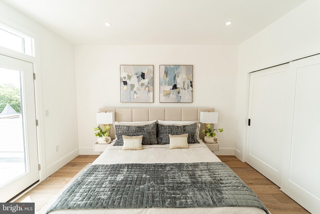 2517 Ontario Rd NW Unit Ph8, Washington, DC 20009 - bedroom with light wood finished floors, recessed lighting, baseboards, and access to exterior