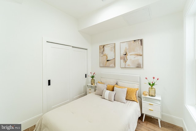 2517 Ontario Rd NW Unit Ph8, Washington, DC 20009 - bedroom with light wood-type flooring, a closet, and baseboards