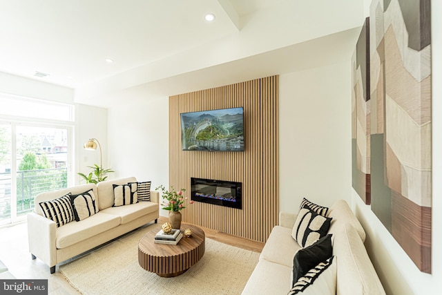 2517 Ontario Rd NW Unit Ph8, Washington, DC 20009 - living area featuring wood finished floors, a glass covered fireplace, and recessed lighting