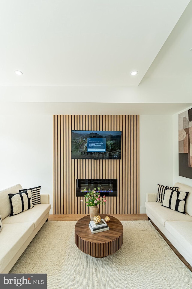 2517 Ontario Rd NW Unit Ph8, Washington, DC 20009 - living room with a glass covered fireplace, recessed lighting, and wood finished floors