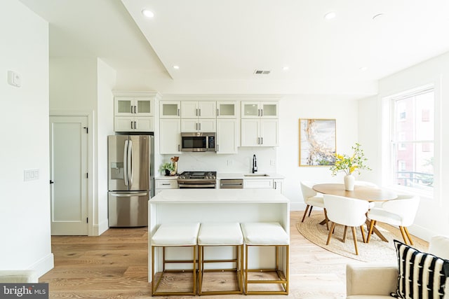 2517 Ontario Rd NW Unit Ph8, Washington, DC 20009 - kitchen featuring appliances with stainless steel finishes, recessed lighting, light wood-style flooring, baseboards, and light countertops