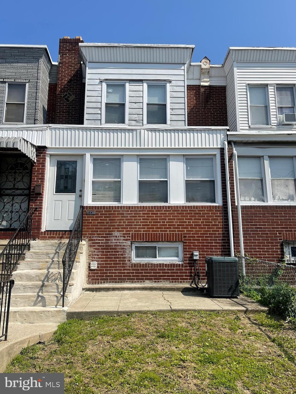 6438 Buist Ave, Philadelphia, PA 19142 - view of front of property featuring central AC and brick siding