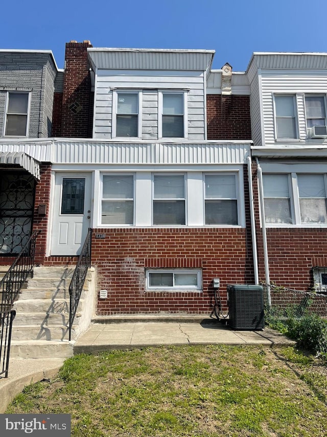 6438 Buist Ave, Philadelphia, PA 19142 - view of front of property featuring central AC and brick siding