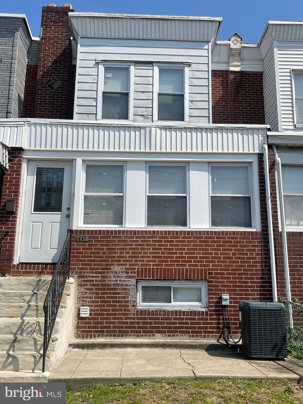 6438 Buist Ave, Philadelphia, PA 19142 - view of front facade with central AC and brick siding