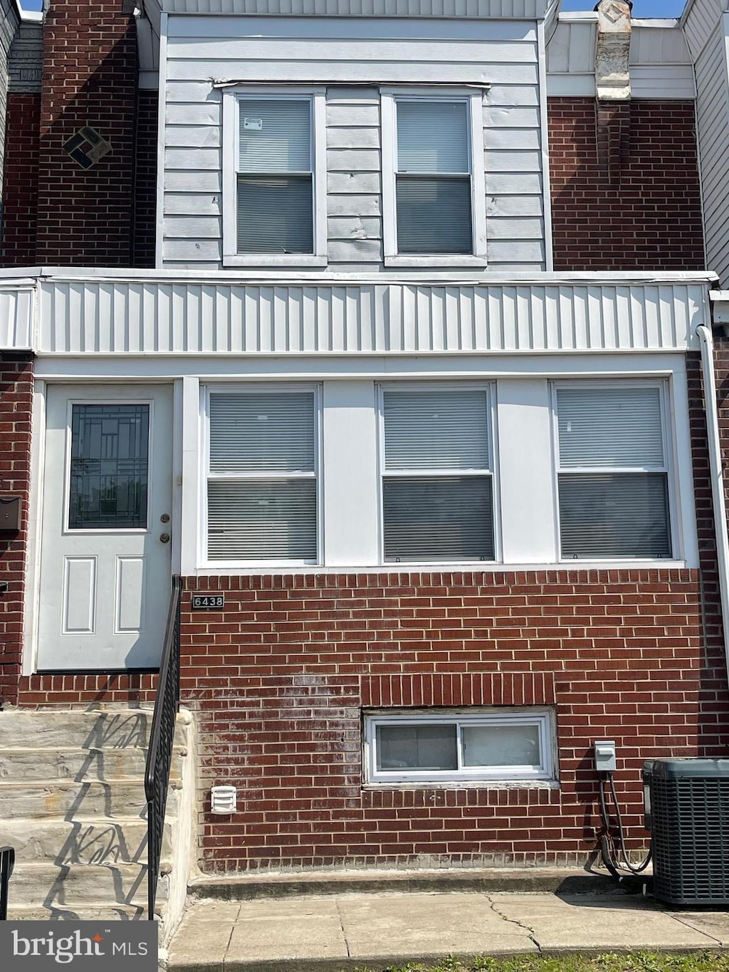 6438 Buist Ave, Philadelphia, PA 19142 - view of home's exterior with central AC unit and brick siding