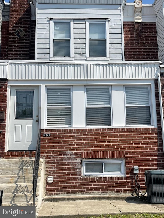 6438 Buist Ave, Philadelphia, PA 19142 - view of home's exterior with central AC unit and brick siding