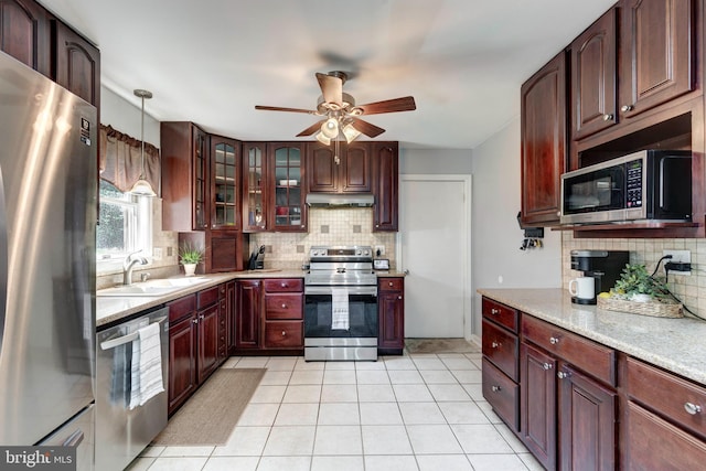 680 Geneva Dr, Westminster, MD 21157 - kitchen with stainless steel appliances, ceiling fan, tasteful backsplash, under cabinet range hood, and light countertops