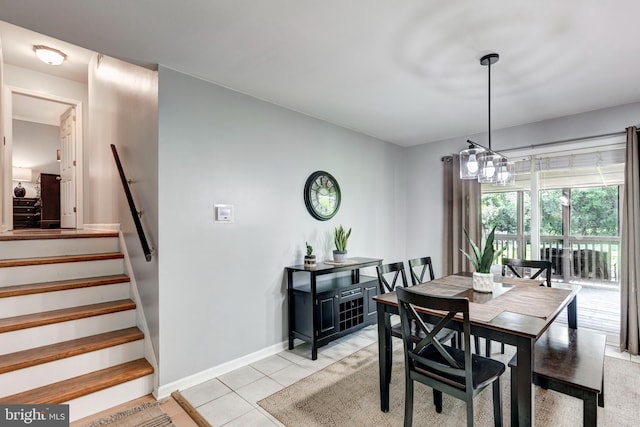 680 Geneva Dr, Westminster, MD 21157 - dining room with stairs, light tile patterned floors, baseboards, and a chandelier