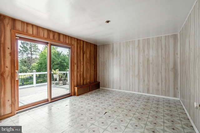 225 E State St, Coopersburg, PA 18036 - empty room featuring tile patterned floors and wood walls