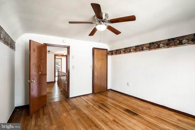 225 E State St, Coopersburg, PA 18036 - unfurnished bedroom featuring wood-type flooring, vaulted ceiling, a closet, baseboards, and ceiling fan
