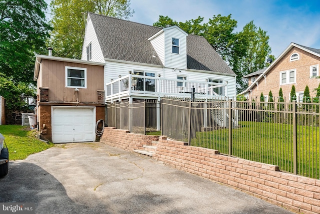 225 E State St, Coopersburg, PA 18036 - view of front facade featuring driveway, a garage, roof with shingles, and a deck
