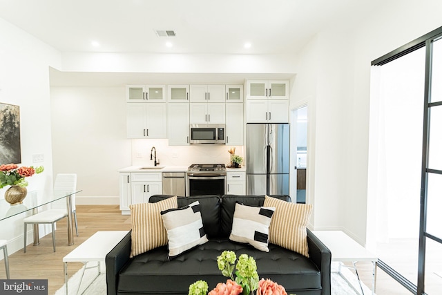 2517 Ontario Rd NW Unit 6, Washington, DC 20009 - living area featuring light wood finished floors, recessed lighting, and healthy amount of natural light