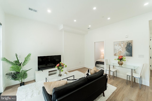 2517 Ontario Rd NW Unit 6, Washington, DC 20009 - living room with light wood finished floors and recessed lighting