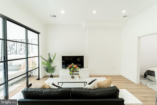 2517 Ontario Rd NW Unit 6, Washington, DC 20009 - living area featuring light wood finished floors and recessed lighting