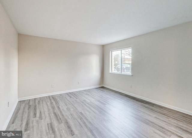 6 Monroe St Unit 6-101, Rockville, MD 20850 - spare room with wood finished floors and baseboards