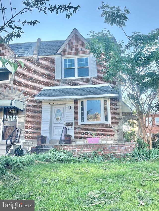 6226 Cardiff St, Philadelphia, PA 19149 - view of front facade featuring brick siding and roof with shingles