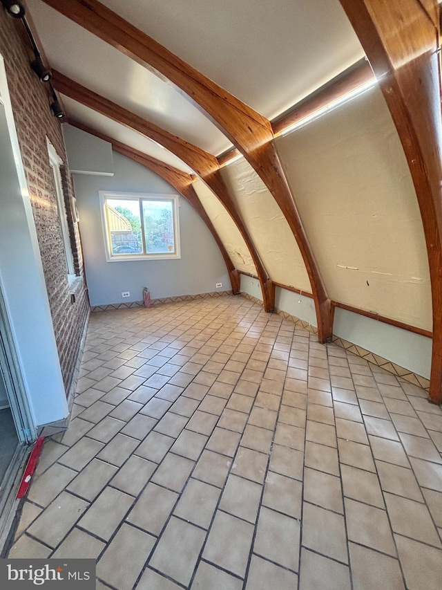 6226 Cardiff St, Philadelphia, PA 19149 - bonus room featuring brick wall and light tile patterned flooring