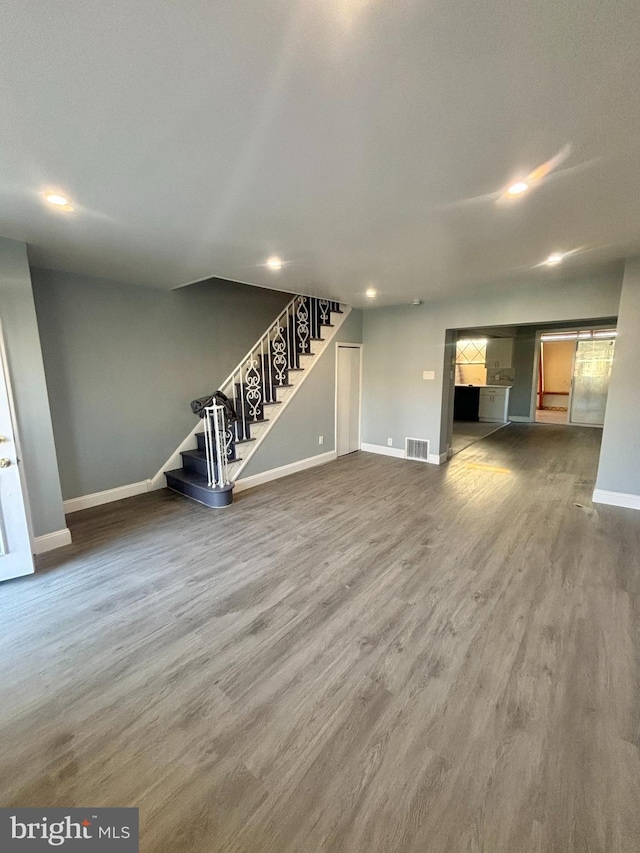 6226 Cardiff St, Philadelphia, PA 19149 - unfurnished living room featuring baseboards, stairs, recessed lighting, and wood finished floors