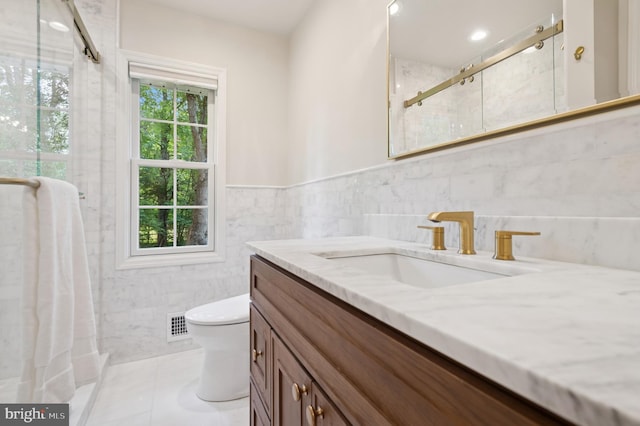 32 Gallup Rd, Princeton, NJ 08540 - full bathroom featuring vanity, a shower stall, tile walls, and a wainscoted wall