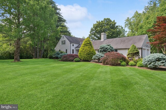 32 Gallup Rd, Princeton, NJ 08540 - view of front of property featuring a front yard, a chimney, an attached garage, and roof with shingles