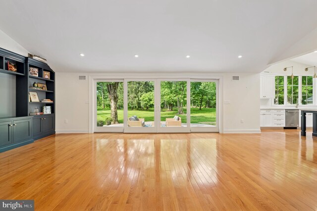 32 Gallup Rd, Princeton, NJ 08540 - unfurnished living room with healthy amount of natural light, light wood-style flooring, lofted ceiling, and recessed lighting