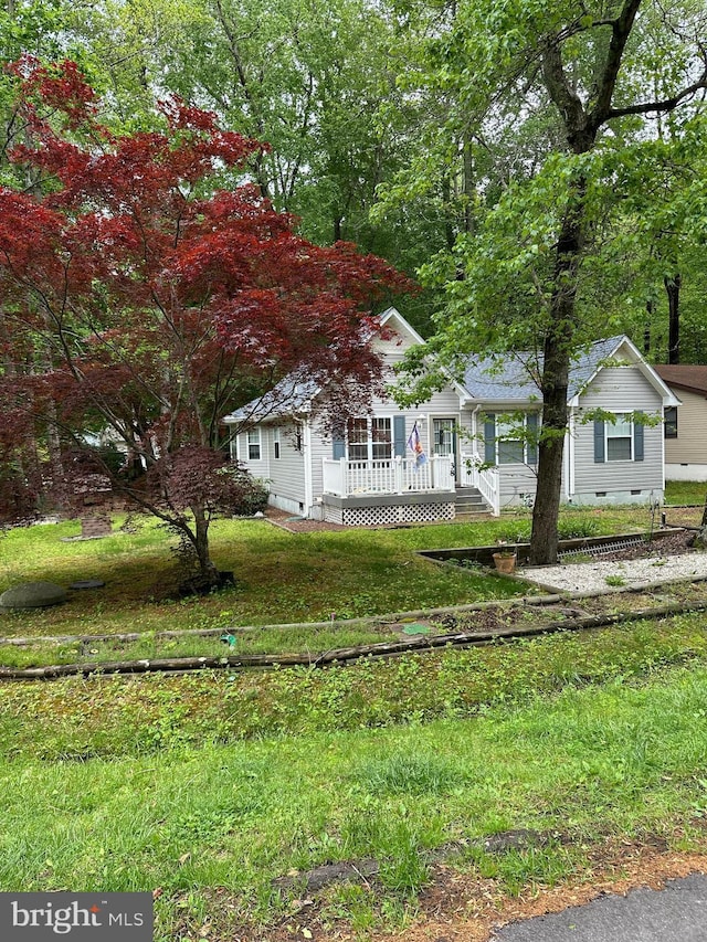 38 Garrett Dr, Ocean Pines, MD 21811 - view of property hidden behind natural elements with crawl space and a porch