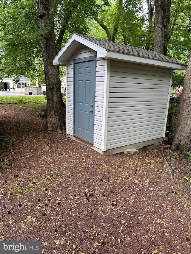38 Garrett Dr, Ocean Pines, MD 21811 - view of shed featuring view of scattered trees