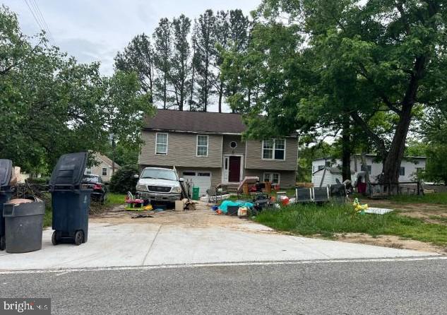 12707 Duckettown Rd, Laurel, MD 20708 - raised ranch with an attached garage and driveway