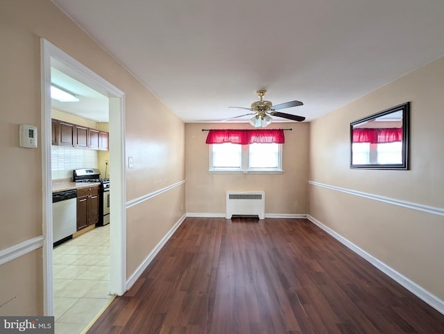 3407 Verner St, Drexel Hill, PA 19026 - empty room featuring radiator heating unit, a ceiling fan, and wood finished floors