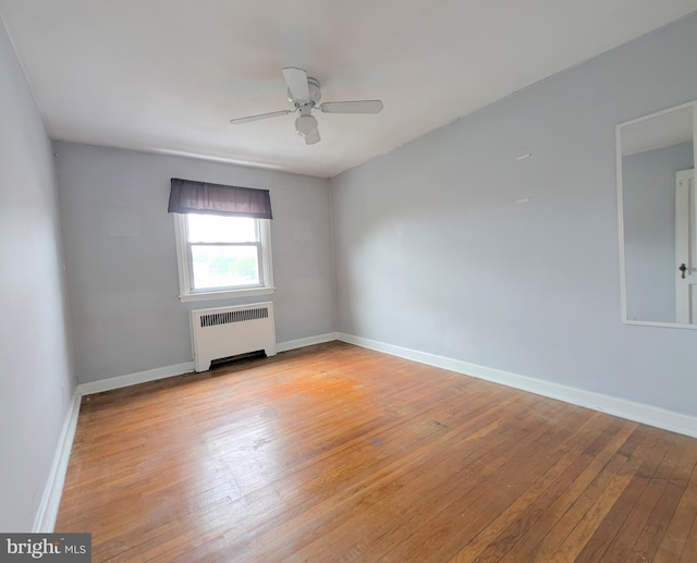 3407 Verner St, Drexel Hill, PA 19026 - unfurnished room with radiator heating unit, light wood-type flooring, and ceiling fan