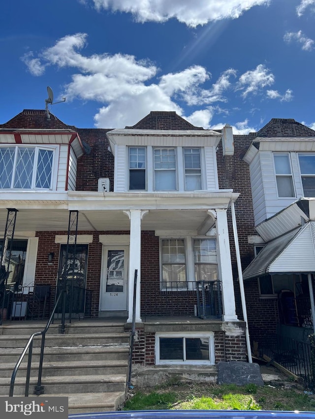 5224 Florence Ave, Philadelphia, PA 19143 - view of front of house with a porch and brick siding