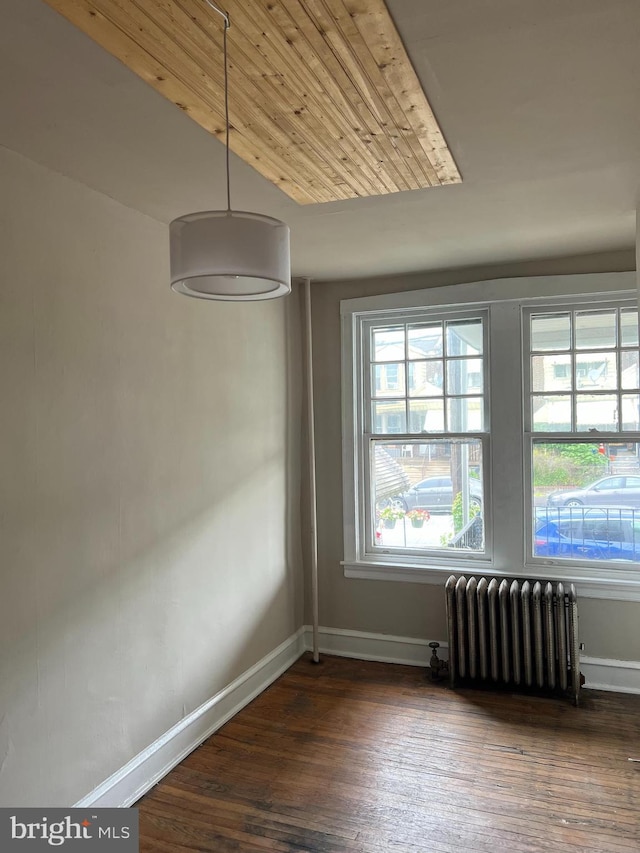 5224 Florence Ave, Philadelphia, PA 19143 - unfurnished dining area with radiator, baseboards, and wood finished floors