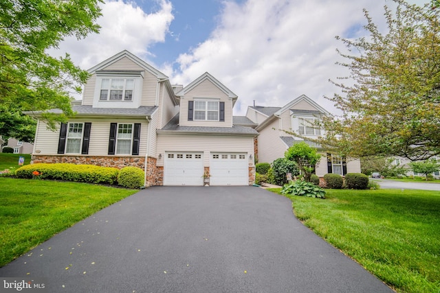 854 Hinchley Run, West Chester, PA 19382 - view of front of property with stone siding, driveway, an attached garage, and a front yard