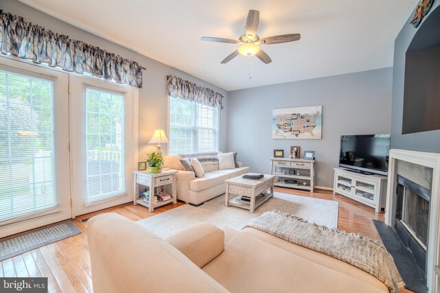 854 Hinchley Run, West Chester, PA 19382 - living area featuring a high end fireplace, a ceiling fan, and wood finished floors