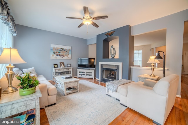 854 Hinchley Run, West Chester, PA 19382 - living area with ceiling fan, wood-type flooring, and a high end fireplace