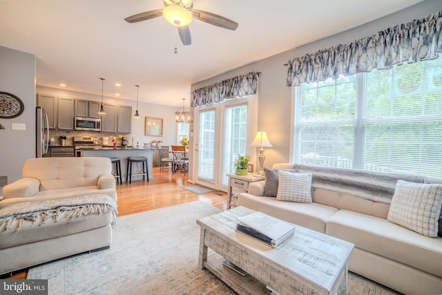 854 Hinchley Run, West Chester, PA 19382 - living area with light wood finished floors, a ceiling fan, a chandelier, and recessed lighting