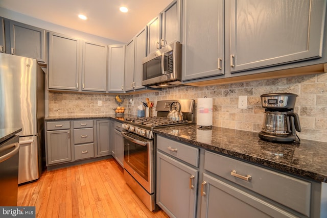 854 Hinchley Run, West Chester, PA 19382 - kitchen with appliances with stainless steel finishes, gray cabinets, light wood finished floors, tasteful backsplash, and recessed lighting