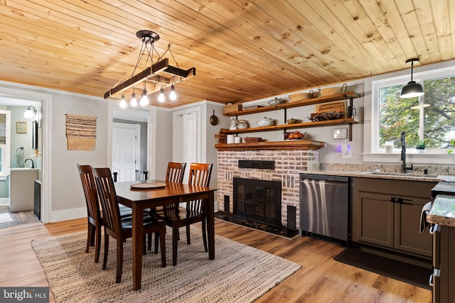 3645 N Susquehanna Trl, York, PA 17404 - dining space featuring wooden ceiling, light wood finished floors, a brick fireplace, and crown molding